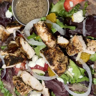 a salad with chicken and vegetables