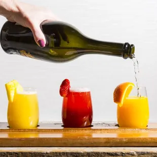  person pouring a glass of wine