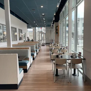  view of a restaurant with tables and booths