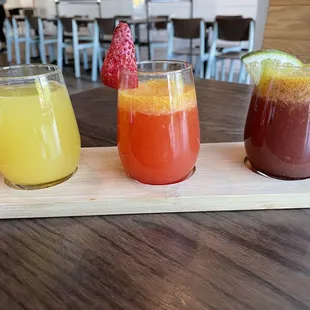Mimosa flight - pineapple, strawberry, and blueberry