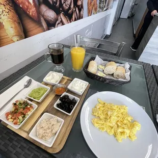 a table with a variety of breakfast foods