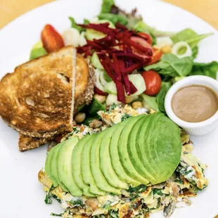 a plate of food with avocado