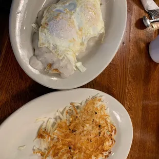 Biscuits and Sausage Gravy Breakfast with over easy eggs and side of hash browns