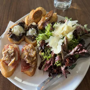 The mushroom, sausage and dried meat toasts with a side salad..