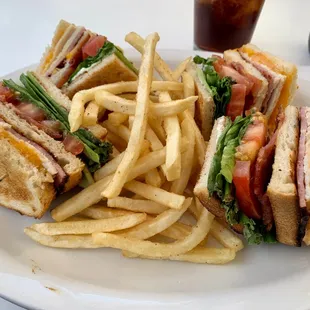 Triple Decker Club with Turkey, Ham, Bacon, Cheddar, Lettuce, Tomatoes, and Mayonnaise on Choice of Bread (Sourdough)