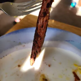So the half piece of sausage cut further in half? You guys burn it????