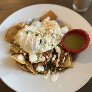 Chilaquiles with a hidden mound of shredded chicken!