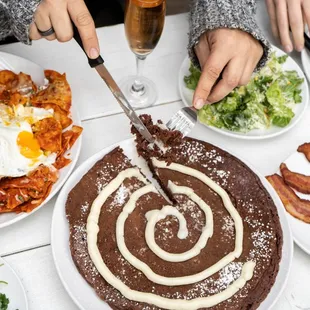 Our house-made chocolate pancake is made with 100% cacao and topped with our house cream cheese frosting.