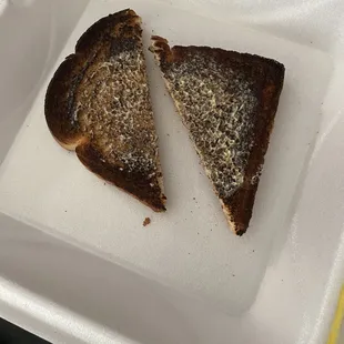 Burnt ass toast! That&apos;s white bread! The name of the restaurant is Toast!  Someone didn&apos;t want to do their job today in the kitchen!