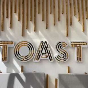 a toast sign on a wall