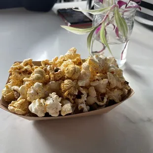 a bowl of popcorn on a table