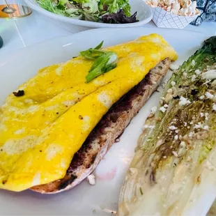 an omelet and salad on a plate