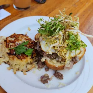 a plate with a sandwich and a drink