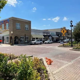 Street view from across the square. You know you are there when you get to the yellow striped awning!