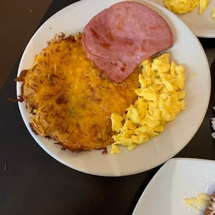 Scrambled eggs, Hash Browns w/ cheese and grilled ham