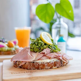 a ham sandwich on a cutting board