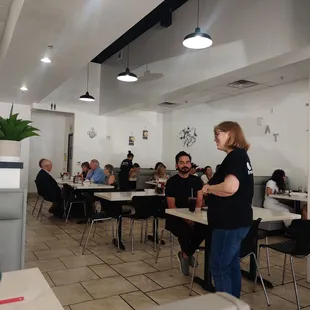 a group of people sitting at tables