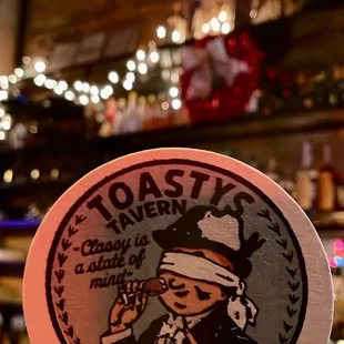 a person holding a sticker