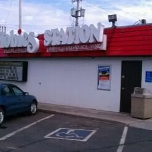 a blue car parked in front of it