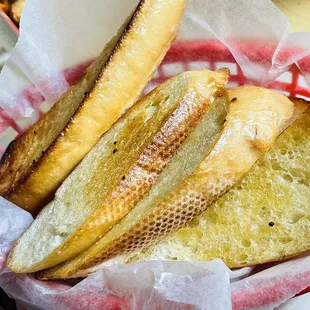 a basket of bread and breadsticks