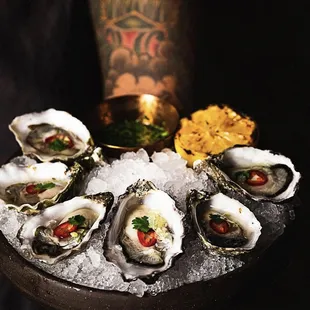 Oysters on the Half Shell- chef's oyster selection by the half dozen, fresno chile, finger lime caviar, pepper &amp; cilantro mignonette.