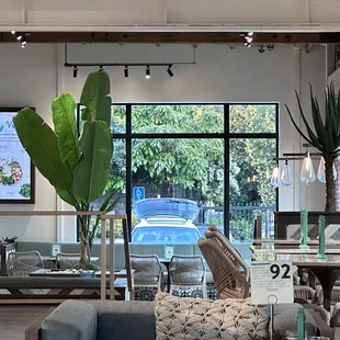 a living room with a couch, chairs, and a table