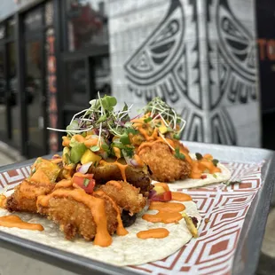 two tacos on a tray