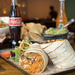 GRILLED BURRITO: Large Flour Tortilla, Rice, Black Beans, Melted Cheese, Guajillo Salsa &amp; A Choice of Protein. Served with a Side Salad