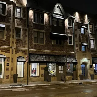 a row of brick buildings at night