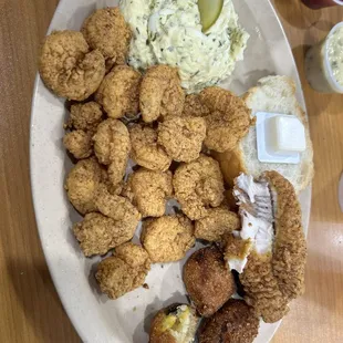 Catfish and fried shrimp with potato salad and hush puppies