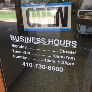 a business hours sign
