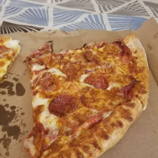 two slices of pepperoni pizza