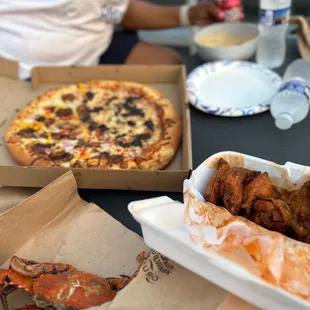 Half oxtail and jerk chicken pizza