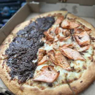 a half eaten pizza in a box