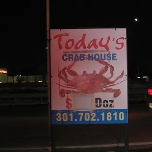 a sign by the side of the road (note that the business is identified as "Today's Crab House."