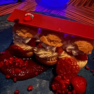 a strawberry shortcake with whipped cream and strawberries