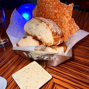 a basket of bread and dips