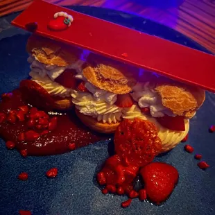 a strawberry shortcake with whipped cream and strawberries