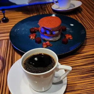 a cup of coffee and a sandwich