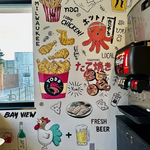 a wall with a variety of stickers on it