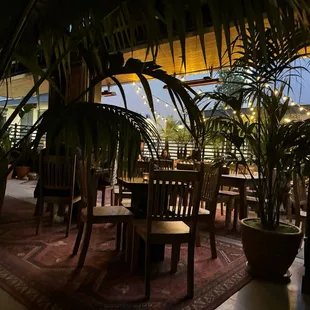 a view of a dining area with tables and chairs