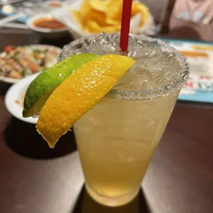 a margarita with a slice of lime on the rim