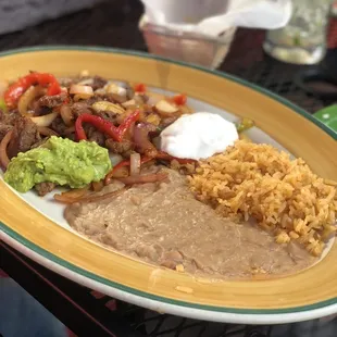 Carne Asada. Very delicious. Food tasted great. The service was very good for how busy it was.