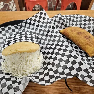 Arepa with cheese and pabellon empanada