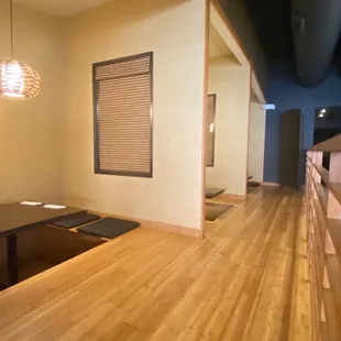 a view of a dining room with a table and chairs