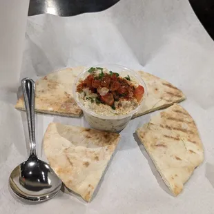 a pita and a bowl of dip