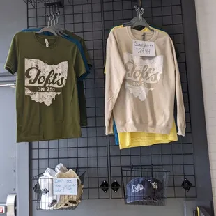 T-shirts, sweatshirts, and hats are all available for purchase