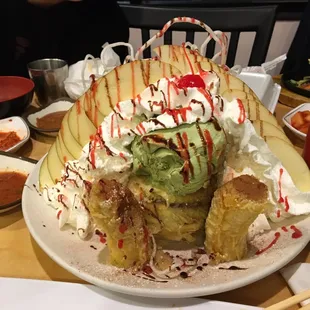 a large plate of food with a variety of toppings