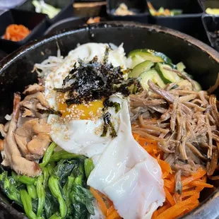 Bibimbap in a hot stone pot.