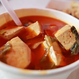 a bowl of soup with a spoon in it